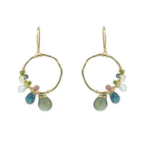 Gold hoop earring with asymmetrical gemstone wraps