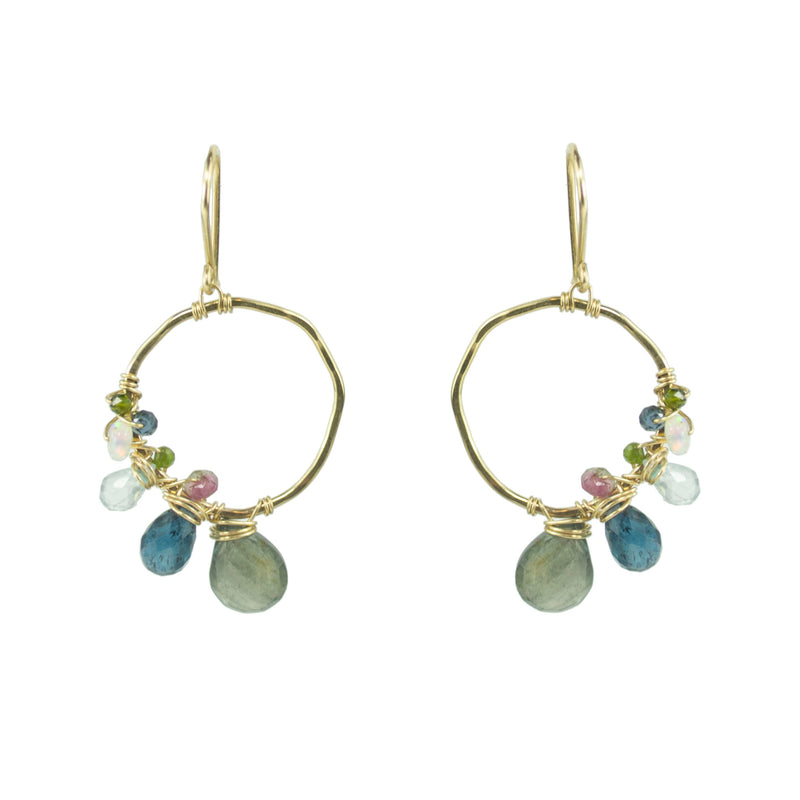 Gold hoop earring with asymmetrical gemstone wraps
