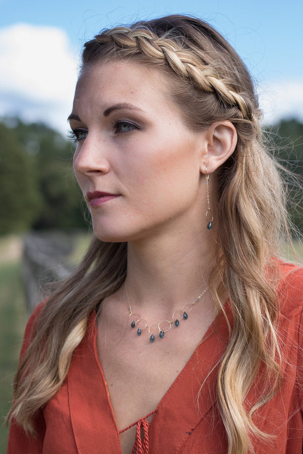 Gold hoop and chain earring with kyanite drop on model