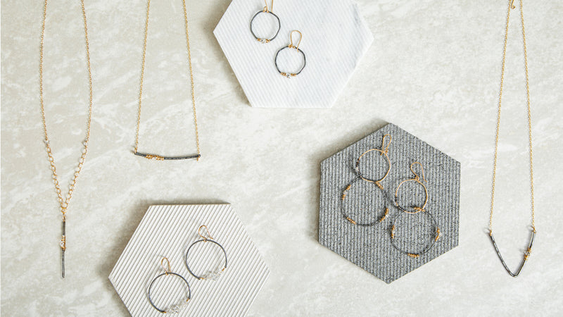 Herkimer diamond collection jewelry laid out all together for a lifestyle shot